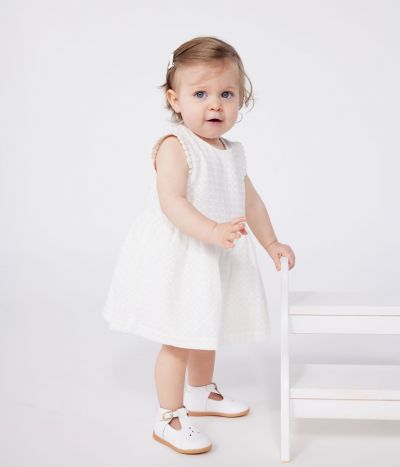 Robe blanche bébé en coton broderie anglaise sans manches