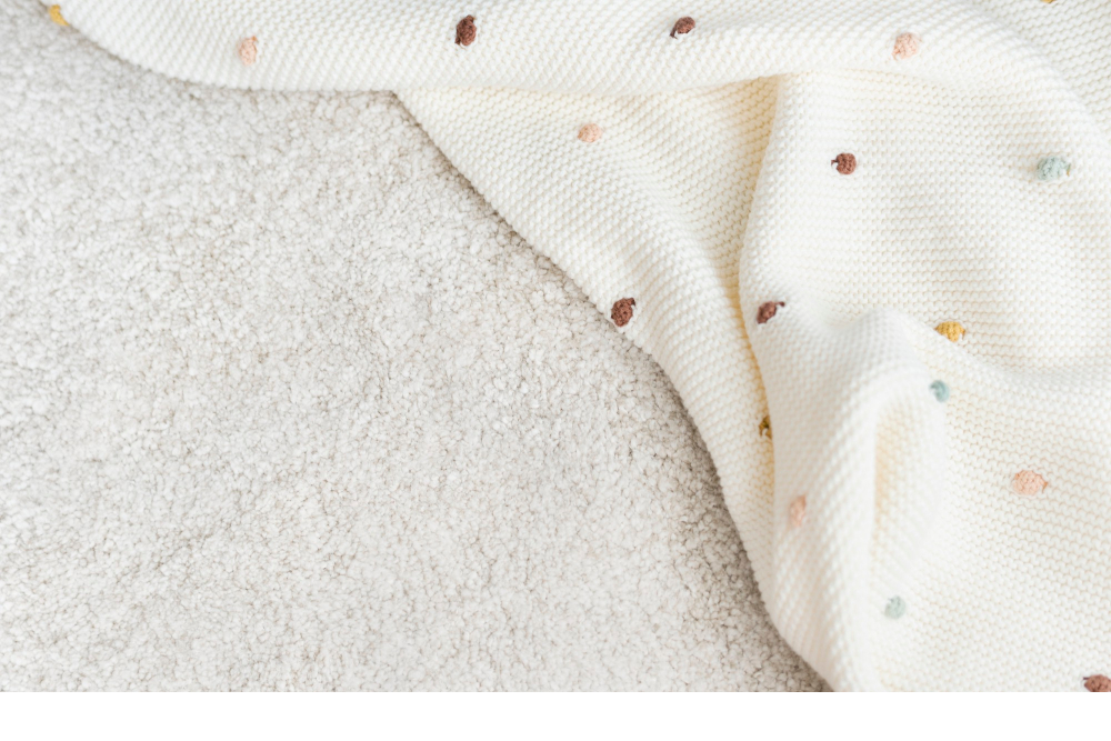 Couverture de naissance : coton ou laine ?